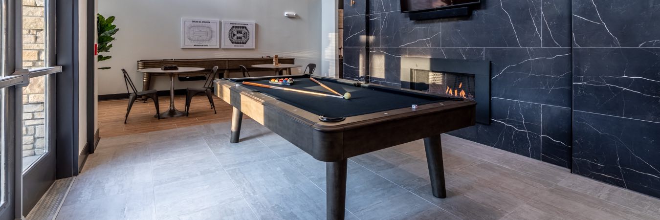 Pool table inside clubhouse at apartment community.