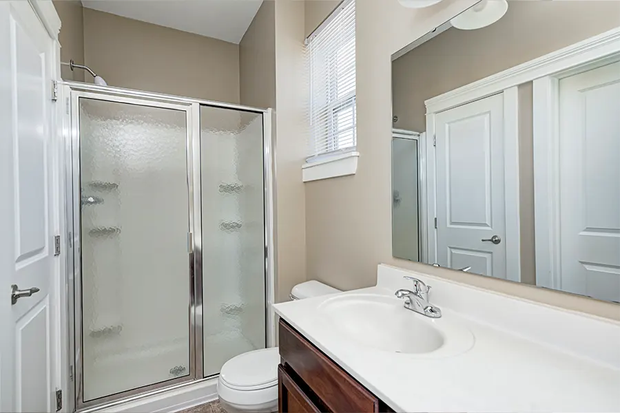If your apartment bathroom has neutral colors like this one at City Flats at Renwick, bring colorful towels and bathroom accessories to brighten it up. Empty apartment bathroom