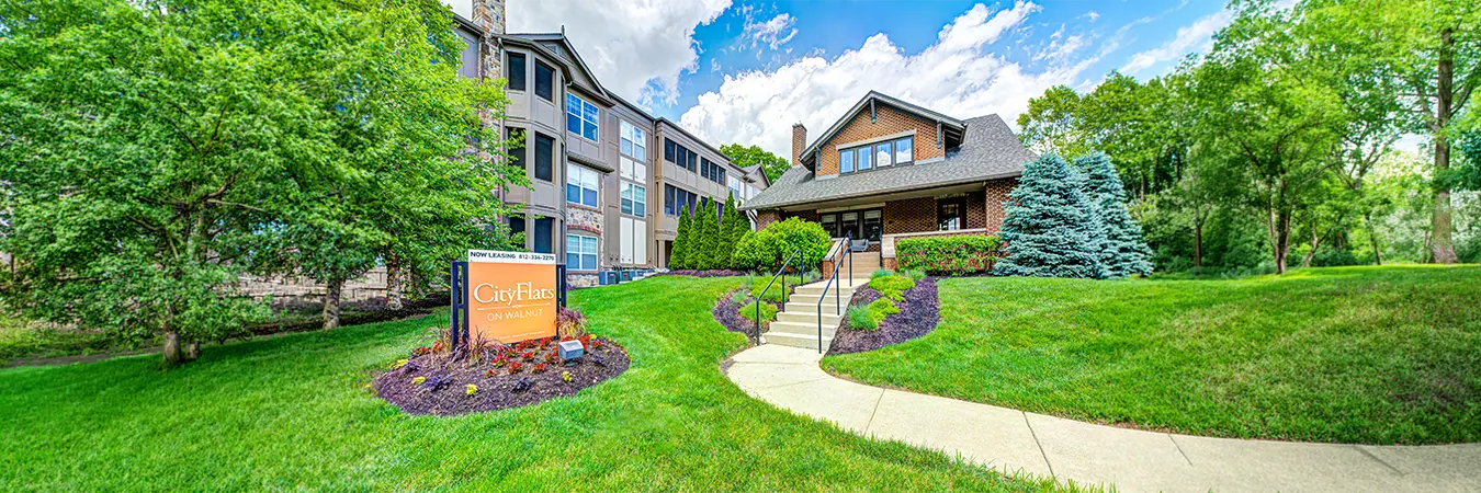 View of the clubhouse and an apartment building at City Flats on Walnut