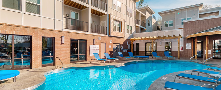 Exterior of apartment building and pool at Echo Park Bloomington