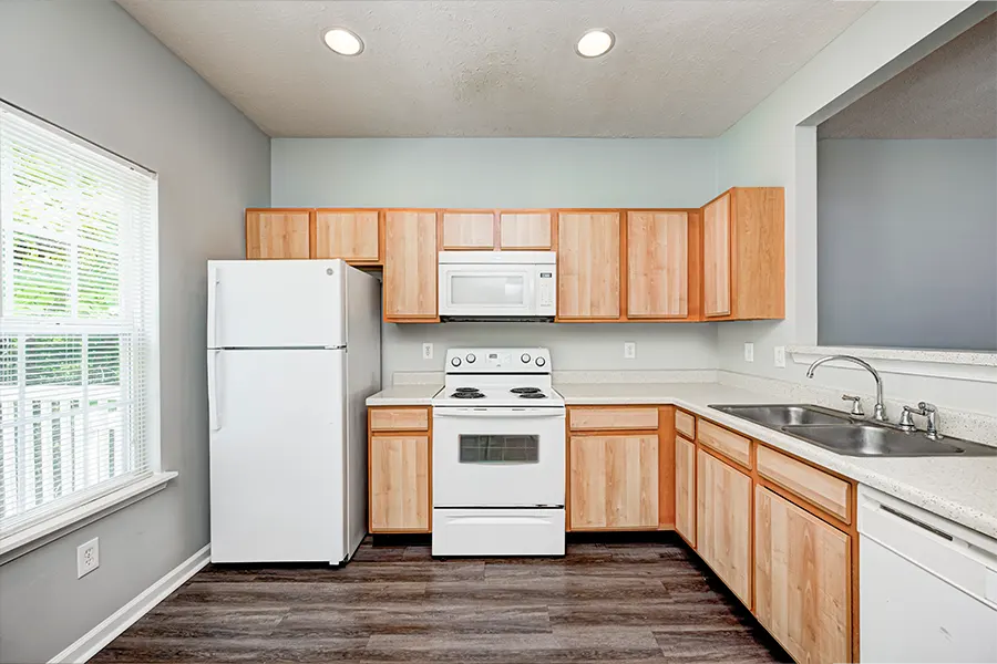You don't have to rely on the school cafeteria when you have an apartment kitchen like this one at City Flats at Tenth Apartments! An empty apartment kitchen