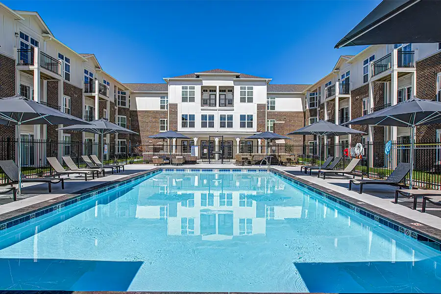 Not sure what a community means by amenities? This pool at Wheelhouse Apartments is one example of an amenity. Pristine pool surrounded by apartment buildings at Wheelhouse Apartments.
